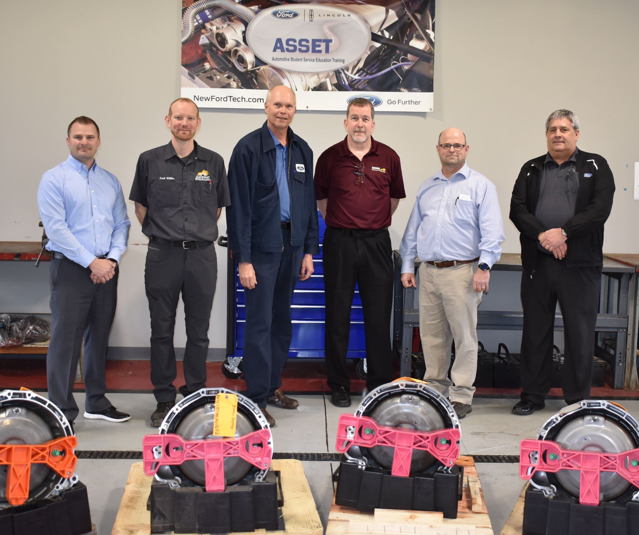 Gateway and Ford employees with donated transmissions.