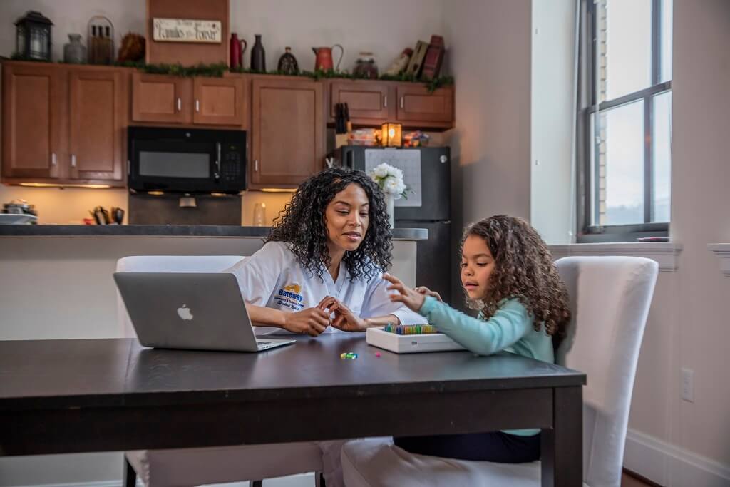 student and mother at kitchen table