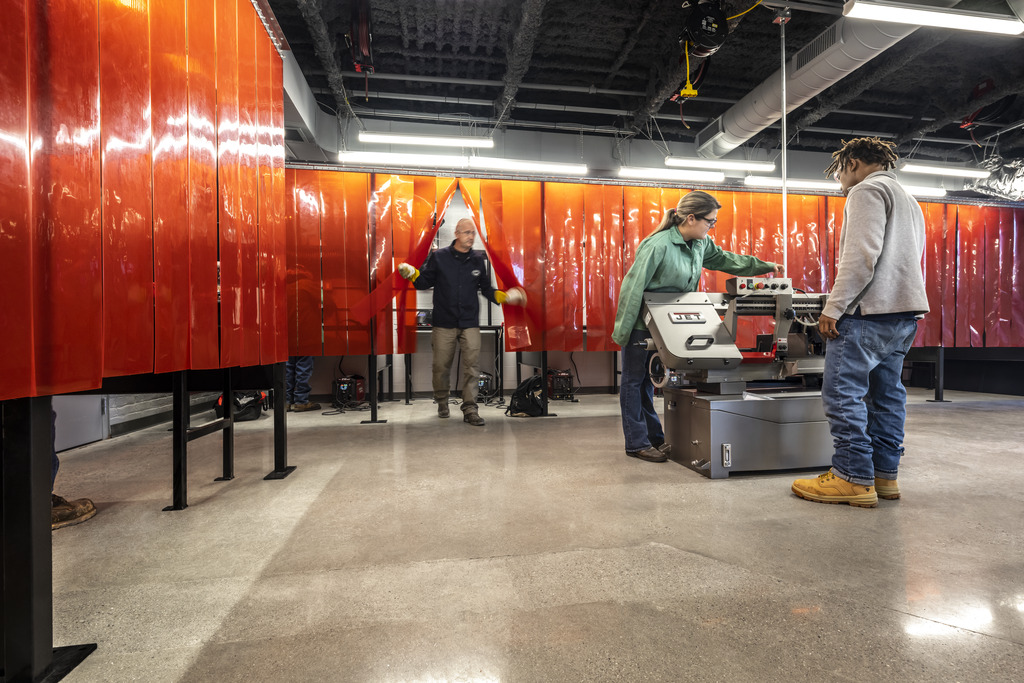 Students in the Learning Labs building using equipment.