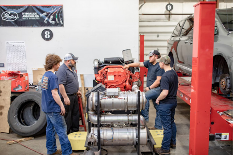 students in automotive classroom with instructor