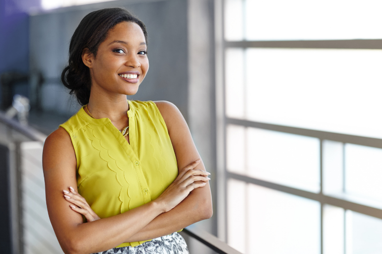 woman smiling in a hallway