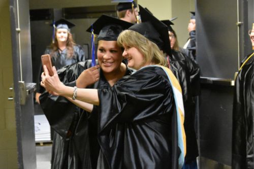 Graduates taking selfie